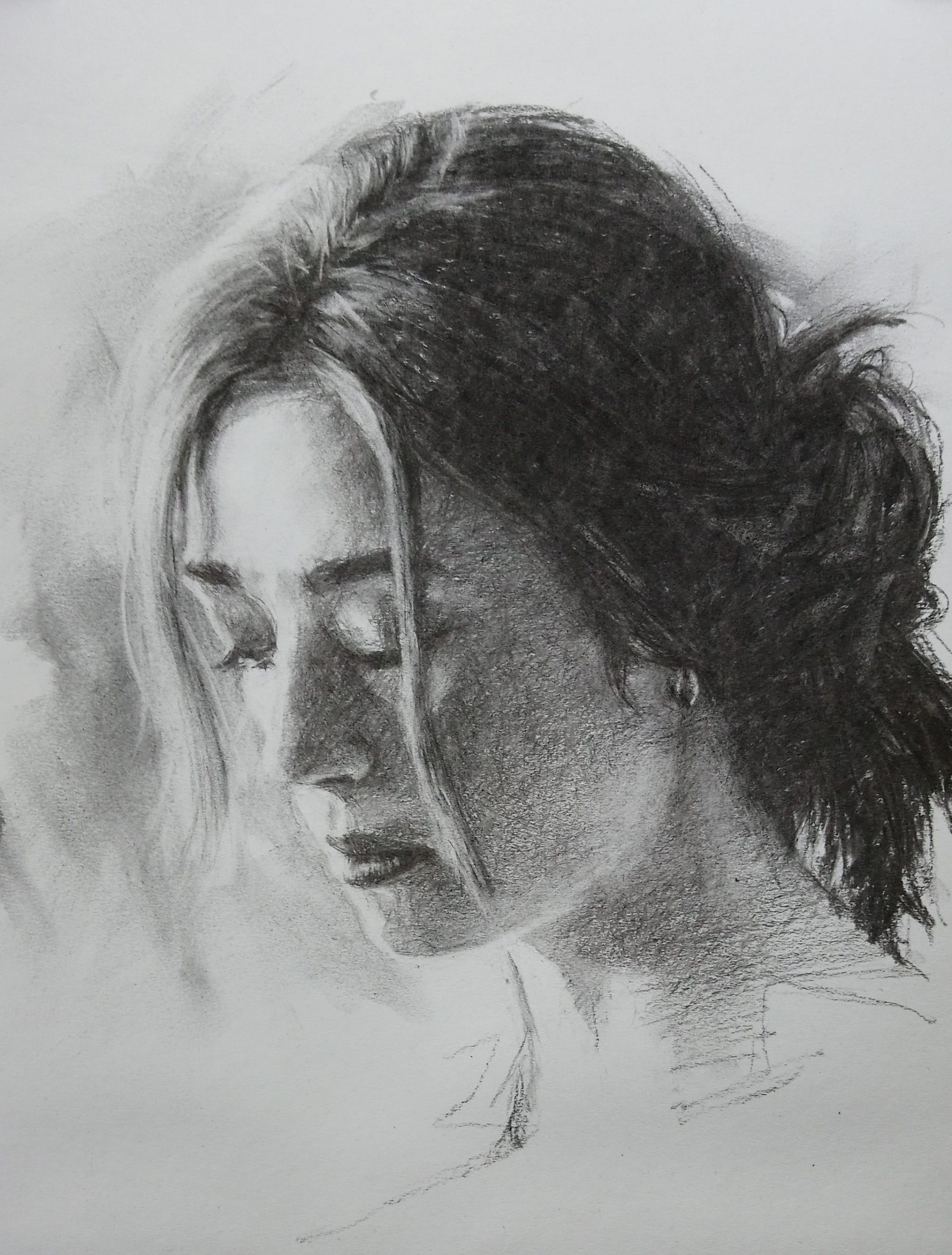 Portrait Assignment 2 – Charcoal drawing of women with hair in a loose bun