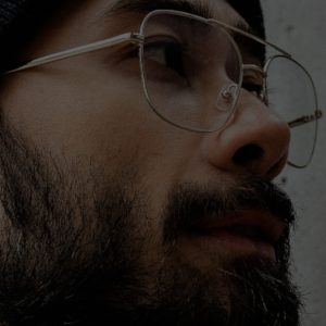 Man with beard and glasses wearing a hat